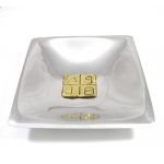 Greek Alphabetic Script brass plaque placed in the center of a recycled aluminum ashtray
